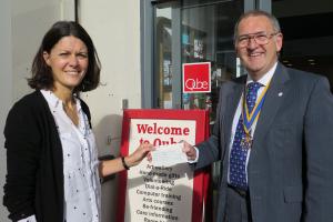 (L-R) Vanessa Baldry receives a cheque from President David Davies from Team Smells Like Toast's sponsored cycle ride plus a donation from Oswestry Rotary Club