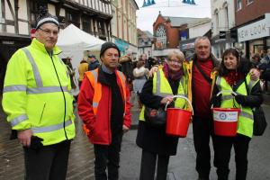 Oswestry Rotarian Justin Soper joins with former District Governor Beryl Cotton, Borderland Past President Harry Richardson, President Sherie Soper and President Elect Geoff Barre