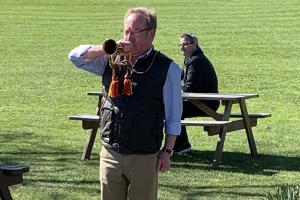 Calling the students to order in preparation for their walk round the park our very own bugler Stuart 