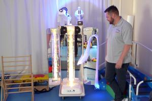 Curtis Langley , Fundraising and Marketing Officer at The Movement Centre with the equipment purchased from the Tree of Light