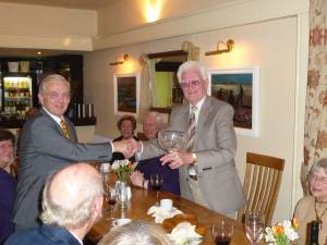 Nick Frame presenting the trophy to Frank Vivian.