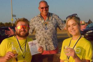 Andy Payne presents Paddy Powney and Beth Eager with their reward for the highest individual fundraisers for the WOLO charity. 