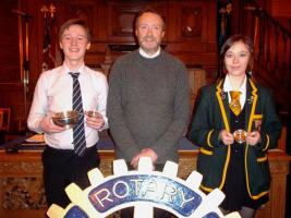 President Alan Lannigan along with Young Musician of the Year, Reece McInroy of James Hamilton Academy on the left and Hilary Newth of Grange Academy, the winning instrumentalist.