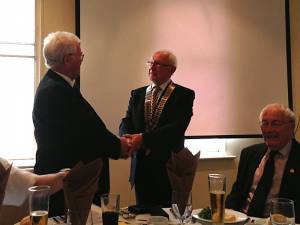 Outgoing President Trevor hands the chain of office to Keith Wood