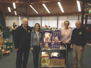 Harry Armstrong, Liz Martin and President Dave Portway with a Food Bank representative.