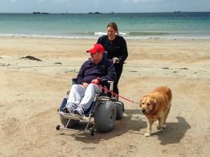 One man and his dog enjoy a trip to the beach