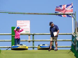 Ann Forsyth and President Ray preparing for the banner exchange.