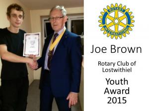 Joe receiving the award from President Elect, Andrew Jeffery