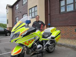 Nigel alongside his bike.