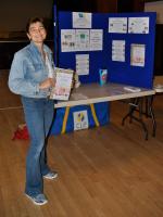 Cath at the Rotary stall promoting our charity fashion show....