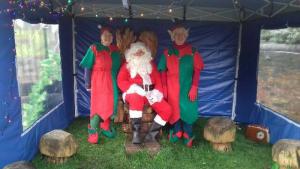 Father Christmas and 2 of his Elves