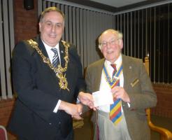 The Lord mayor receives a cheque for his Appeal from President David Collins.