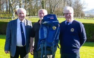 President Brian Mitchelhill&Rotarian Bob Harwood at the presentation of the ruckdacks to Nick Landells from the Cumbria Alliance.