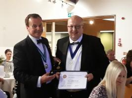 Past District Governor 2017/18 Robert Morphet presents Past President 2017/18 Paul Tinker with his Paul Harris Fellowship award