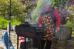 Peter cooks the food ready for the masses!