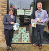 Christine Lunt (wife of club member Martin) presenting the wash bags to Andrew James of the RSH Charity