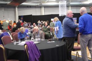 Rotarians mingling between speakers