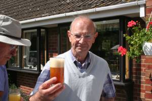 Gordon enjoying a glass of home brew.