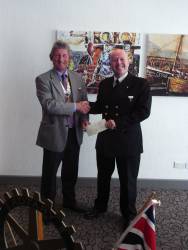 President Nigel presenting a cheque to Tony Jewitt.