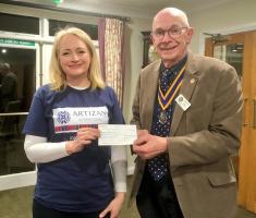 President David Kaye presents a cheque to Susie Hart MBE, CEO of Artizan International