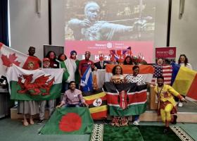 Country flag parade showing the countries represented at the event