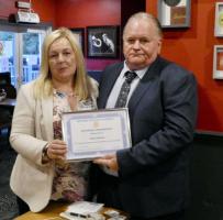 President Paula presenting Honorary Membership to Davie Martin