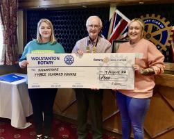 Volunteers from Stoke on Trent & Newcastle Samaritans receive a cheque from our club