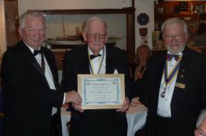 PP Ian McDowall being presented a certificate for 50 years service