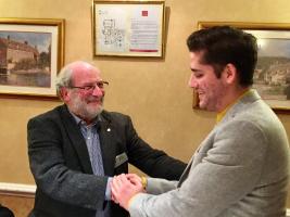 Former RYLA candidate Adam Burford (rt) being thanked by RYLA chief Rtn Robin Wraight (aka Mr Merlot) after he gave a passionate presentation about his experiences on the leadership course and how it has helped him develop personally and professional