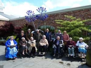 Rotarians, with residents and staff of Alexander House at Barton Grange
