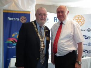District Governor Andy Lees (on left) with outgoing D.G. John Waddell