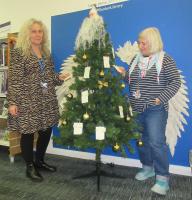 Librarians at Dunbar showing the Angel Tree for the photo for the 'East Lothian Courier'