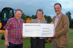 Picture shows Rotary President Gordon Steele presenting Dumfries and Galloway Society for the Deaf chair John Denerley with the cheque. John is best known to local people as the director of Galloway Wildlife Park in Kirkcudbright. Also in the picture