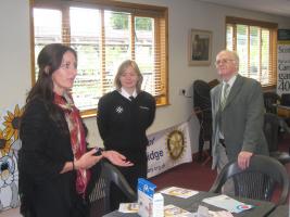 Vicky from OMRON and Lucie from St Johns Ambulance talk with John(Rotary).