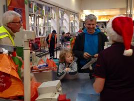 John Davies packs for a Christmas shopper