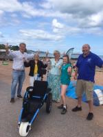 Handover of beach wheelchair by Rotary Presidents to THHN and Outdoor Reach, who will house the chair at South Sands Goodrington 