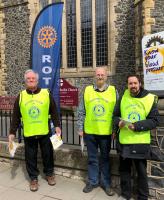 Rotarians Chris Drew Steve Butler and Ray Khan form an unlikely group of medical auxiliaries as they invite passing members of the public to have their blood pressure tested by Dr. Ashok Harshey and his team