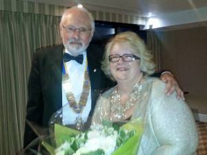 President Bob presenting flowers in thanks to Club Secretary Hazel