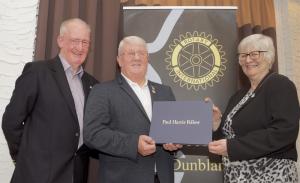 John Kilby with District Governor Ian Dowe presenting Paul Harris Fellowship to Breda Seaman in Dunblane