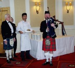 Paul Hamilton prepares to pipe in the haggis.