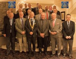 The attached photo shows a group of Stirling Rotary Club members and visitors. Front row, middle, is President Frank Kelly with, on his left (our right) Eddie Cramb, President of Carse of Stirling Rotary Club.