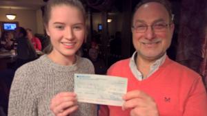 Presenting Becky with a cheque for £500 to support her work