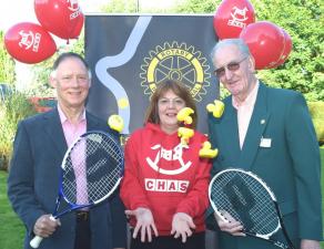 Alison Rennie, Fund Raiser for CHAS, throws up a handful of Duck Race competitors, with Nick Rawlings, President Elect of Bridge of Allan and Dunblane Rotary Club (left) and John Kilby, Chairman of the Club"™s Community Committee (right), dusting down th