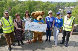 Photo shows, left to right, Rotarian Mike Dixon, Knaresborough Rotary President Helen Westmancoat, Martin House Regional Fundraiser Rebecca Taylor, Marty Bear, Knaresborough Rotary President Elect Deborah Wilson, Vice President Stephanie Blevins and 