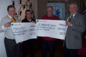 Cheque presentation to Magpas and St Andre'w Chruch. 