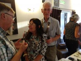 Cheryle Berry talking to Web Master Mike , with President Trevor in close attention