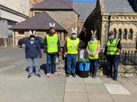 Five of the  eight Rotary “Easter Bunnies”, all COVID compliant, posing for the camera 