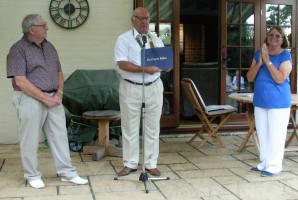 Retiring Letchworth Howard president Dave Glanville (centre) presents Colin Green with his Paul Harris Fellowship citation while Colin’s wife Karen looks on.  