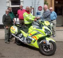 Rotary President Tom Green, together with club members, handing over Sheila’s keys to SERV OBN Chairman Kamran Irani