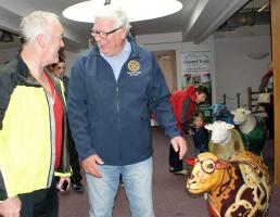 Rotarian Nick Capron explaining the finer points of "˜sheep art"™ on the final day of the Go Herdwick exhibition at Rheged. The forthcoming auction of the sculptures will raise funds for a planned extension to the Calvert Trust buildings at Bassenthwai